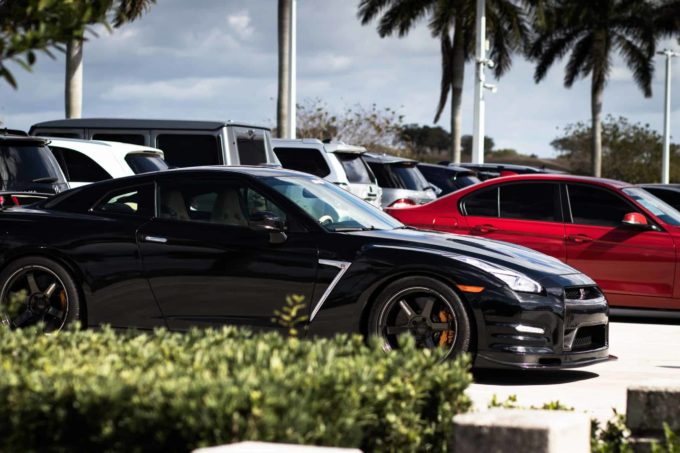 Black Nissan GT-R sports car parked in lot with other vehicles Cash for Cars Texas – Don't Trade It In