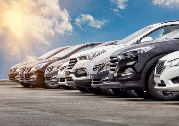 Row of cars parked under sunny sky Cash for Cars Texas – Don't Trade It In